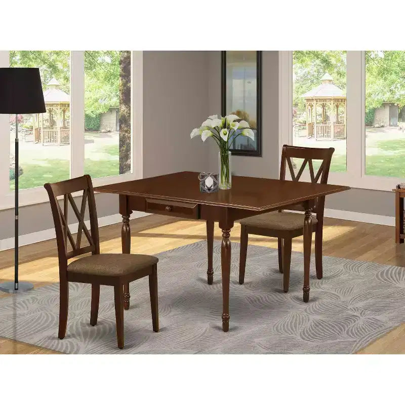 Tavolo da pranzo con piano in legno massello finitura mogano e alette abbattibili